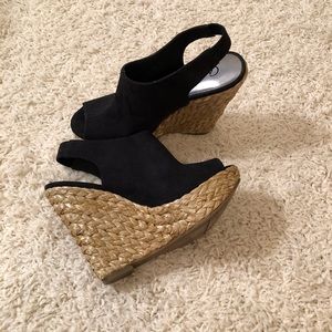 Carlos Santana black straw wedges
